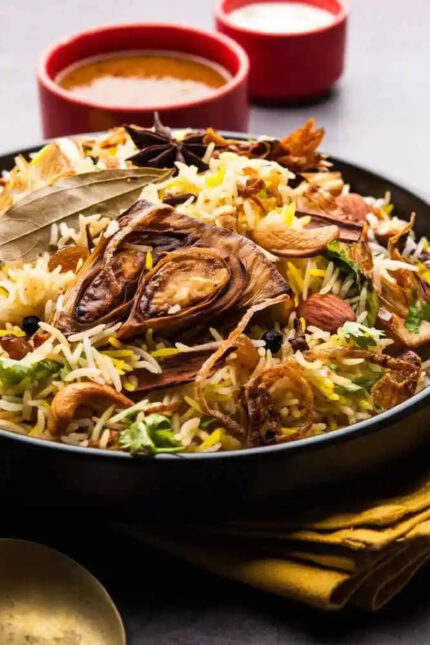 Aromatic South Indian biryani layered with spices, raisins, and cashews at Zari Crawley.