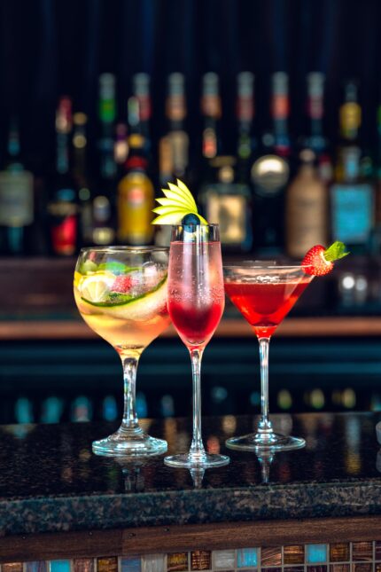Colorful signature mocktails and cocktails lined up beautifully at the restaurant bar.