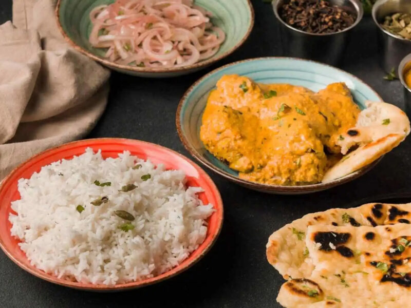 Aromatic South Indian chicken curry served with a bowl of fluffy basmati rice at Zari.