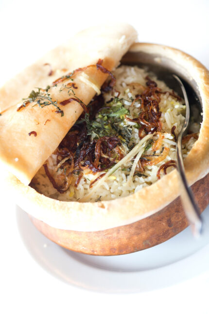 Fragrant basmati pilau rice seasoned with aromatic herbs and whole spices.