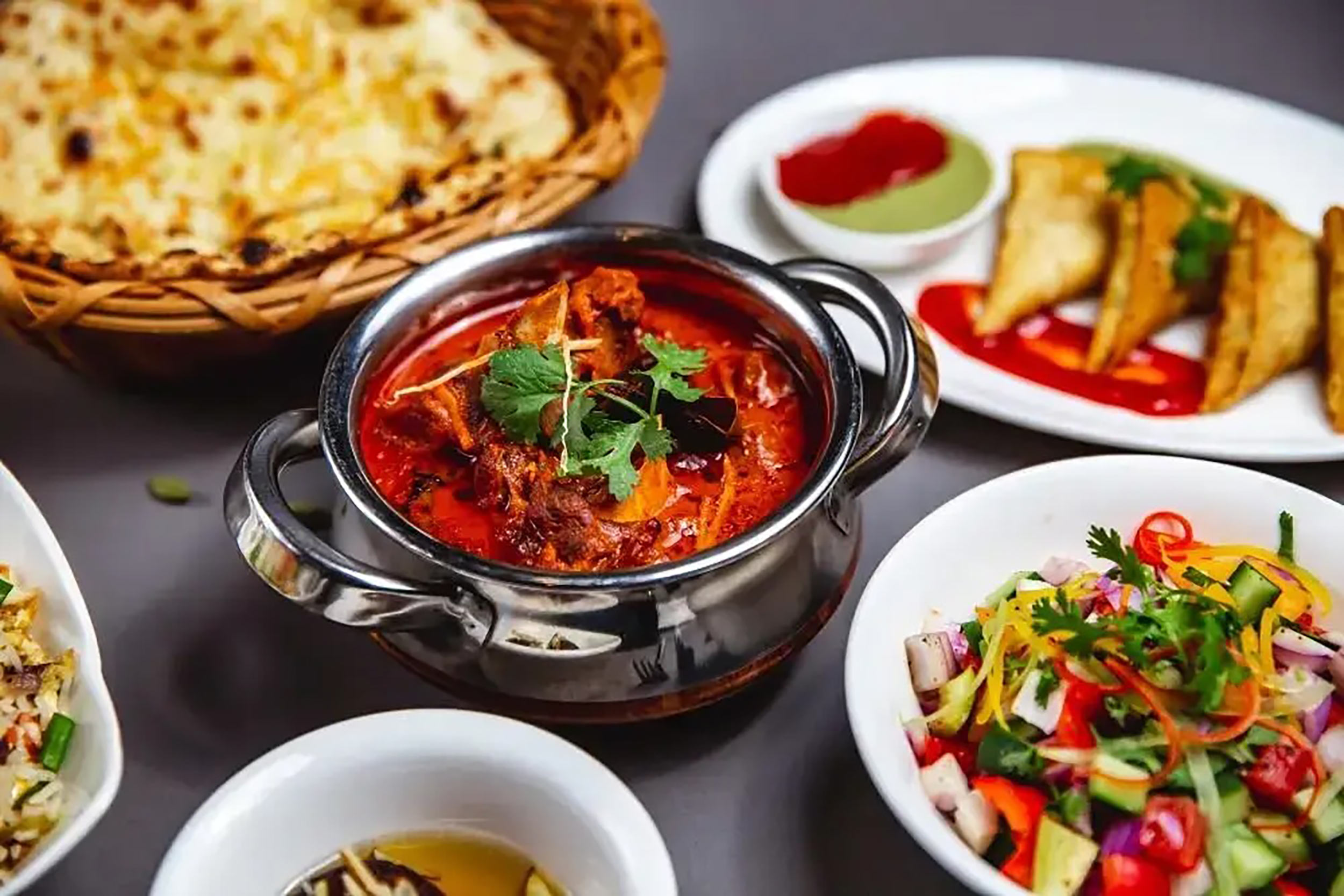 Gourmet Bengali fish curry main course served fresh at Zari Indian restaurant.