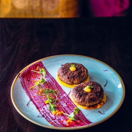 Two gourmet minced meat kebabs on mini flatbreads served as a Father's Day starter in Crawley.