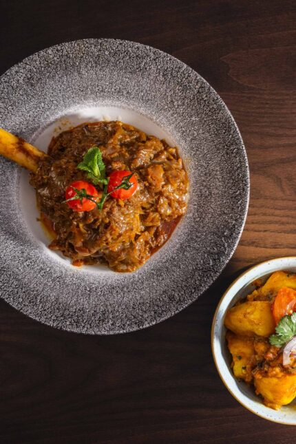 Authentic slow-cooked Hyderabadi chicken curry at Zari Restaurant, Crawley.