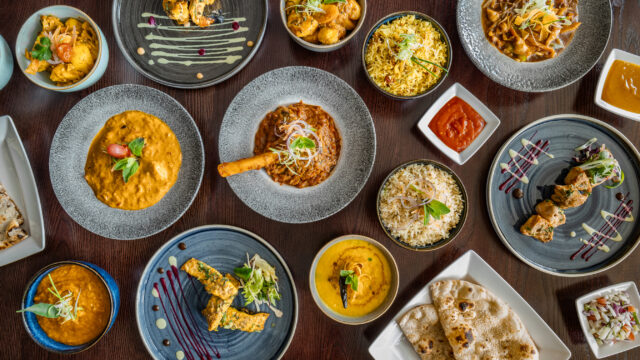 Chef preparing authentic Indian takeaway meals at Zari Restaurant in Crawley.