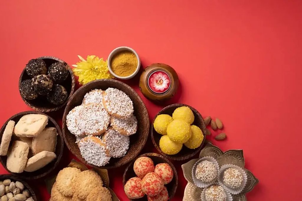 An assortment of colorful traditional Indian sweets and ladoo at Zari Crawley.
