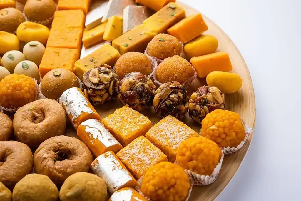 Assorted authentic mithai, burfi, and laddu desserts at Zari Indian Restaurant.