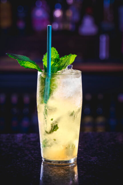 A refreshing mint cocktail with a blue straw, perfect for New Year celebrations.