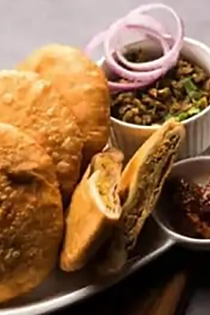 Golden crispy onion kachori pastry stuffed with caramelized onions and aromatic spices.