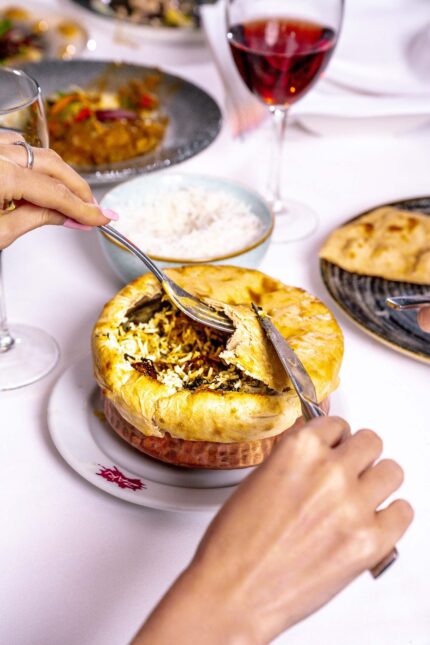 A biryani cooking pot sealed tightly with dough for the authentic dum pukht method.