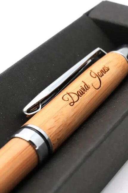 Laser engraved personalised bamboo eco pen inside a black gift box.