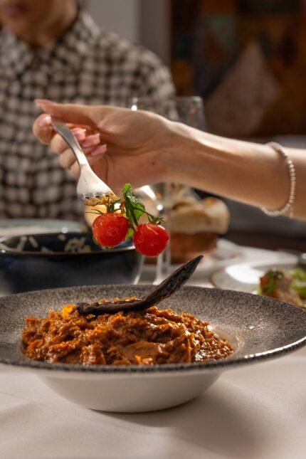 Slow-cooked traditional lamb curry entrée prepared with regional spices.