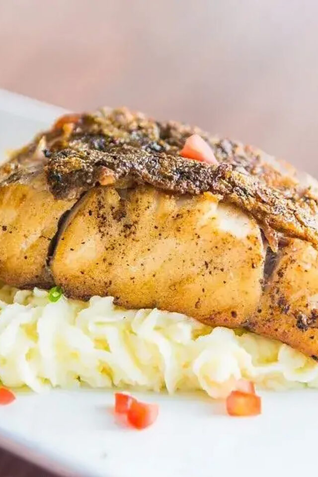 Pan-fried sea bass seasoned with traditional five-spice panch phoron and turmeric.