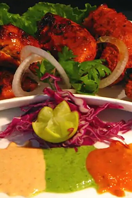 Cooling mint chutney and fresh side salad to complement hot tandoori chicken.