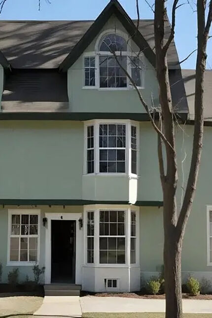 harming historic building exterior with multi-storey bay windows near Horsham town centre.