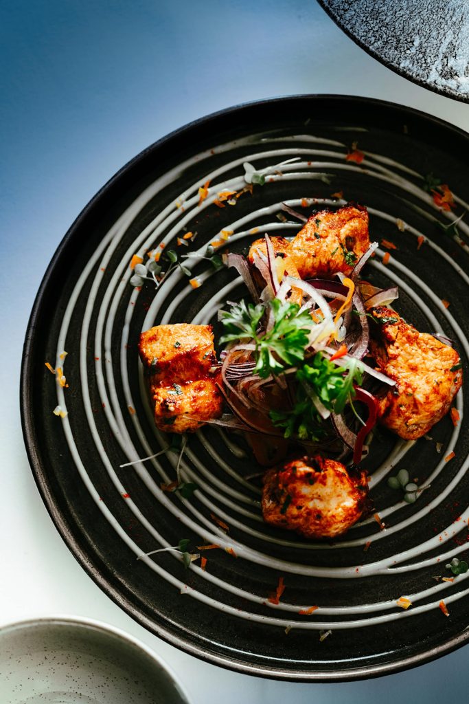 A rich, aromatic chicken tikka masala main course served fresh at Zari Restaurant.