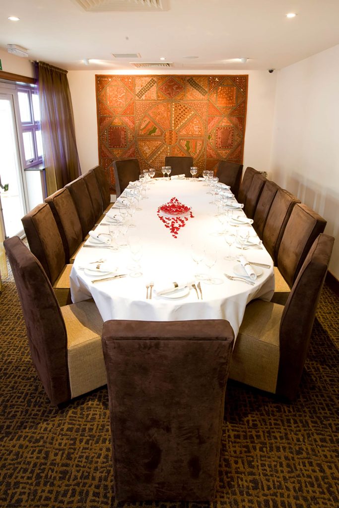 An elegant long banquet table set for full venue hire and private group dining at Zari Crawley.