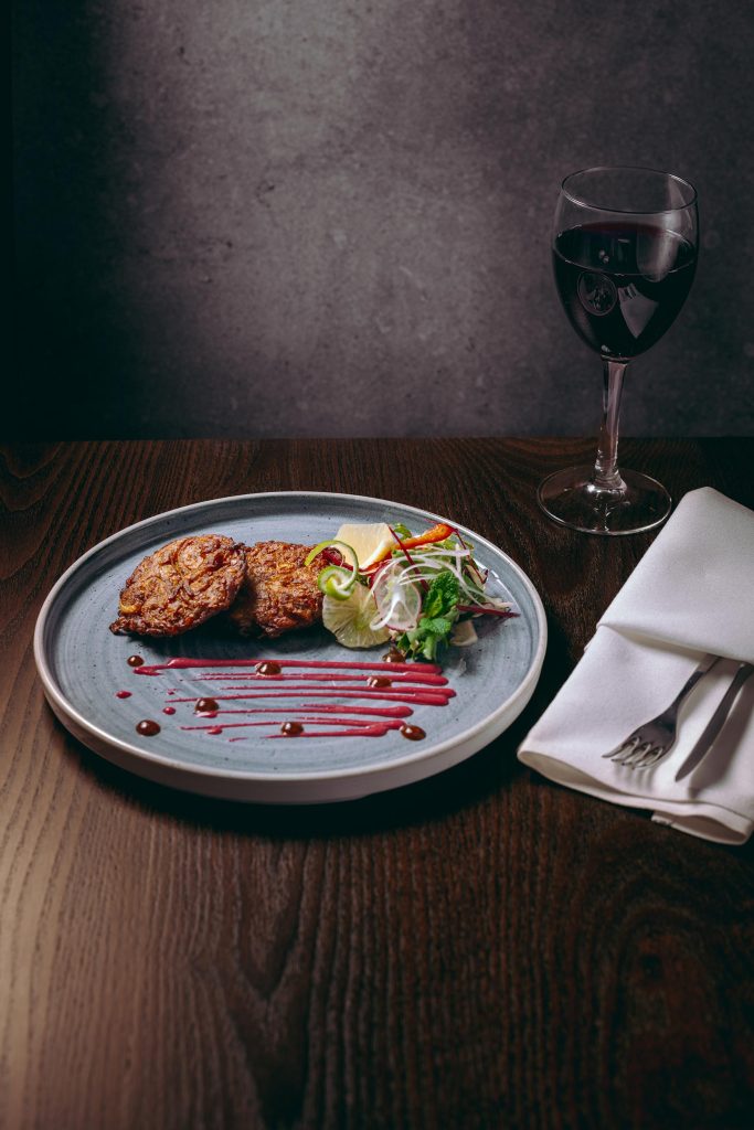 Elegant holiday table setting featuring seasonal spring dish and polished glassware.