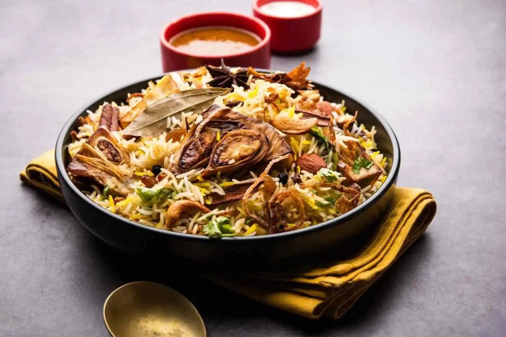 Aromatic South Indian biryani layered with spices, raisins, and cashews at Zari Crawley.