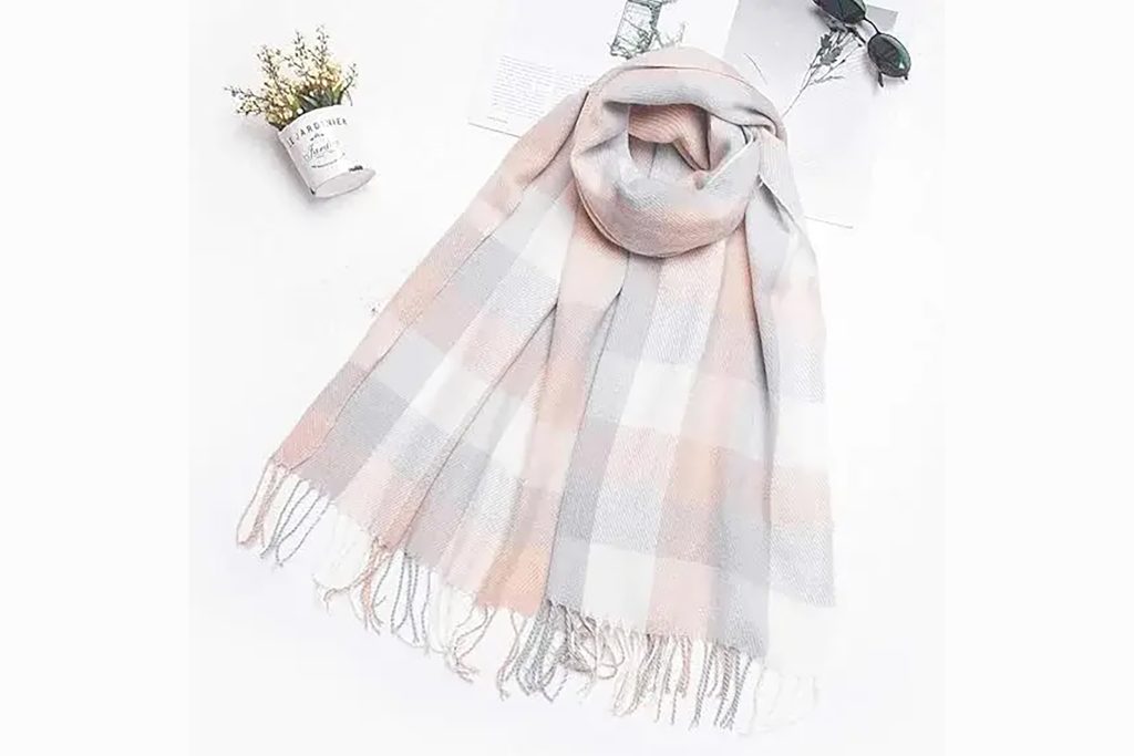 A soft pastel tartan check winter scarf, a popular corporate entertainment gift.